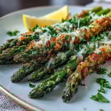 Golden-brown Crispy Asparagus Asiago Spears with tender centers, finished with parsley and extra grated Asiago cheese. 