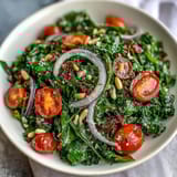 Zesty dandelion greens tossed in lemon vinaigrette, topped with Parmesan, cherry tomatoes, and pine nuts for a vibrant vegetarian salad.