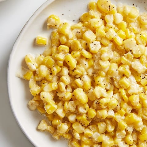 Golden honey butter skillet corn, glistening and hot, a perfect side dish for your meal.