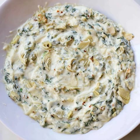 Warm Spinach Artichoke Dip, a creamy appetizer, loaded with cheesy goodness, perfect for snacking.