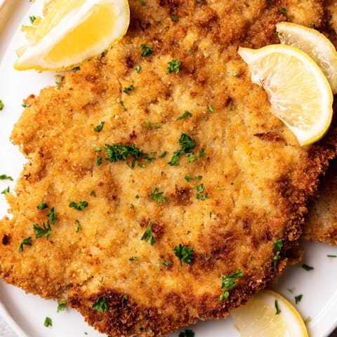 Crispy and tender, this homemade Austrian Wiener Schnitzel looks amazing, with perfectly fried breading.