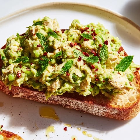 Hearty Smashed Pea & Chicken Toast on rustic sourdough with creamy pea mash.
