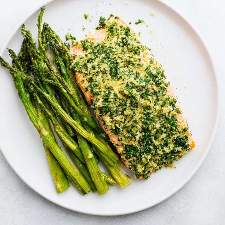 Flaky, oven-baked Easy Herb-Crusted Salmon with bright green asparagus, a delicious weeknight meal.