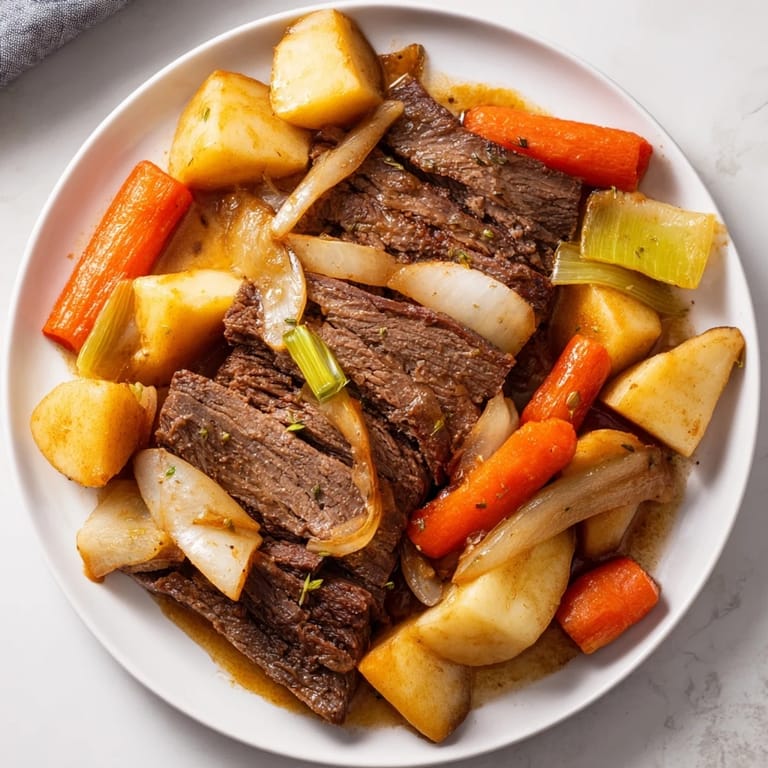 Steaming Slow-Roasted Beef Pot Roast: succulent beef, carrots, and potatoes, perfectly comforting.