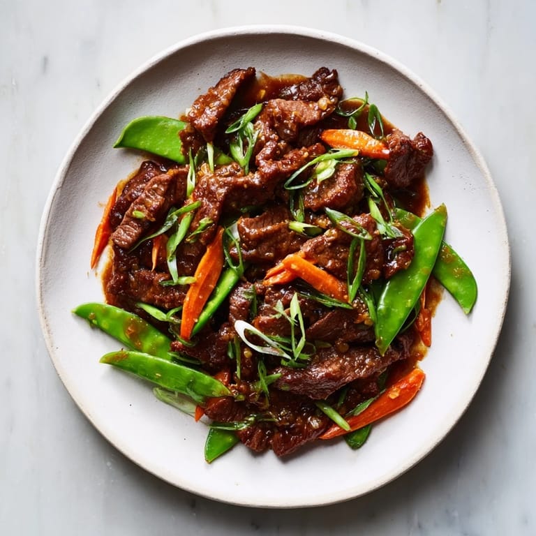 Tender beef and crisp vegetables create this flavorful Skillet Beef Stir-Fry served on a perfect white plate.