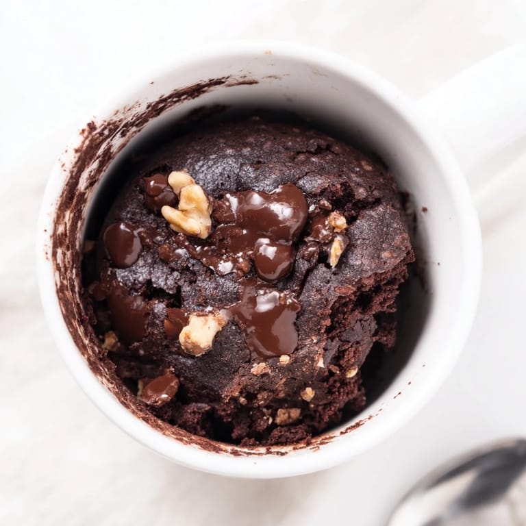 A single-serving, decadent mug brownie; the perfect easy chocolate cake in minutes for a sweet craving.
