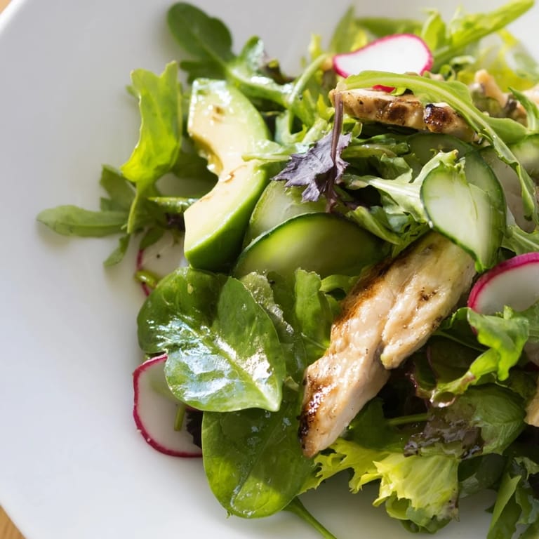 Spring Detox Chicken Salad features tender grilled chicken nestled among avocado slices and colorful veggies, tossed in a bright, homemade lemon dressing for a light meal.